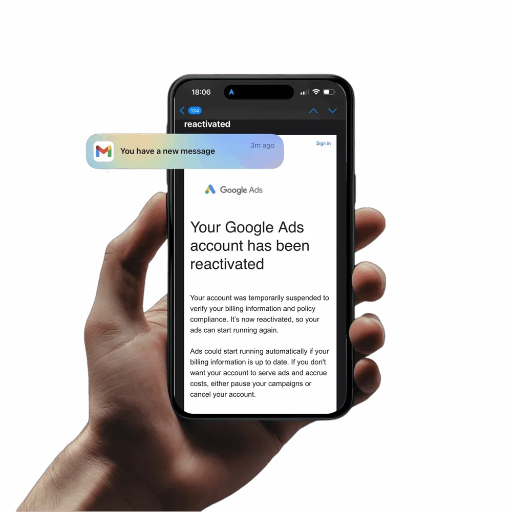 A phone showing the Google Ads email: Your Google Ads account has been reactivated